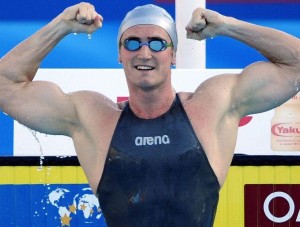 Van Der Burgh of South Africa celebrates after winning and setting a world record in the men's 50m breaststroke swimming semi-final at the World Championships in Rome