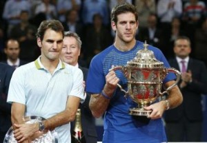 Del Potro of Argentina poses with the winner's trophy after he won his final match against Switzerland's Federer at the Swiss Indoors ATP tennis tournament in Basel