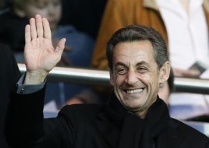 Former French President Sarkozy waves before the start of the French Ligue 1 soccer match where Paris Saint-Germain faces Nice at the Parc des Princes Stadium in Paris