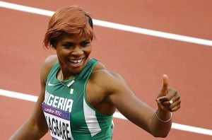 Nigeria's Blessing Okagbare gives the thumbs up sign after placing first in her women's 100m round 1 event at the London 2012 Olympic Games in the Olympic Stadium