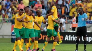 South African players celebrate the goal by Lehlohonolo Majoro (7, not in the picture) against Angola during their African Nations Cup Group A soccer match at the Moses Mabhida stadium in Durban, January 23, 2013. REUTERS/Rogan Ward (SOUTH AFRICA - Tags: SPORT SOCCER)