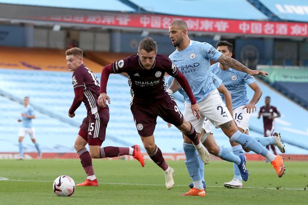 Kyle Walker committing a foul on Jamie Vardy in the penalty spot.