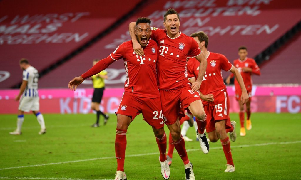 Bayern Munich players celebrate with Robert Lewandowski as he scored four against Hertha Berlin To help them bounce back to winning ways.