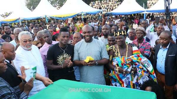 Asamoah Gyan and Rawlings during the commission ceremony of his Sports Complex.