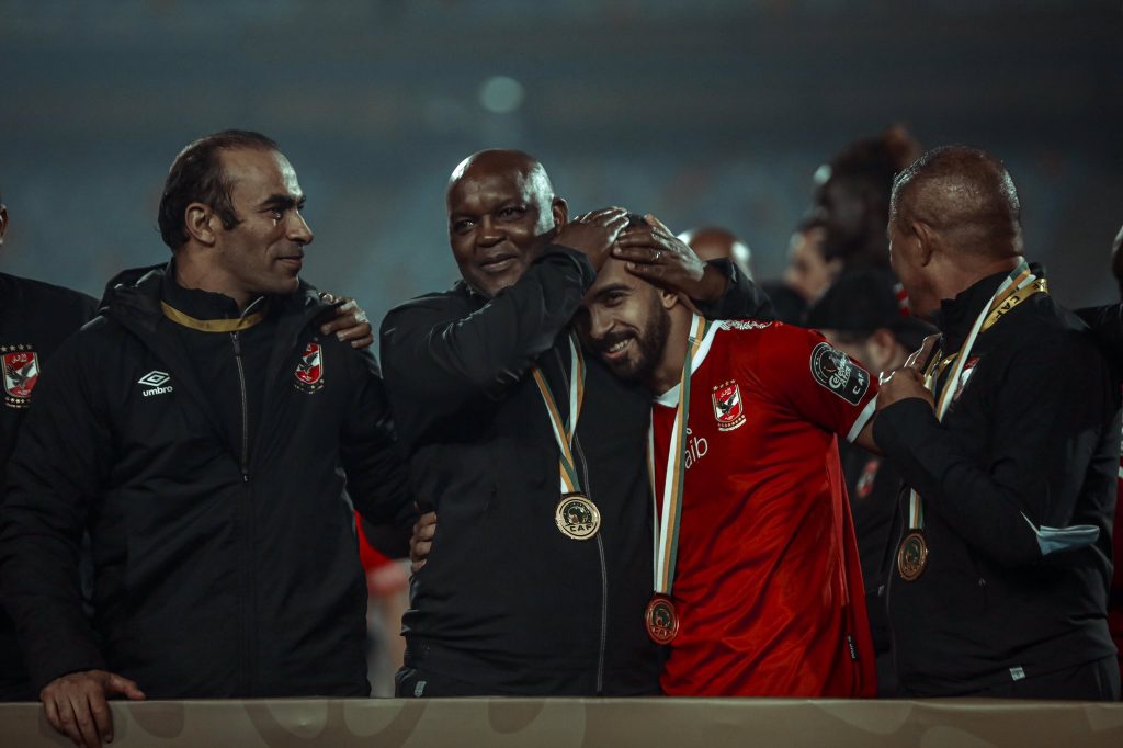 Pitso Mosimane celebrating CAF Champions league title with his players.