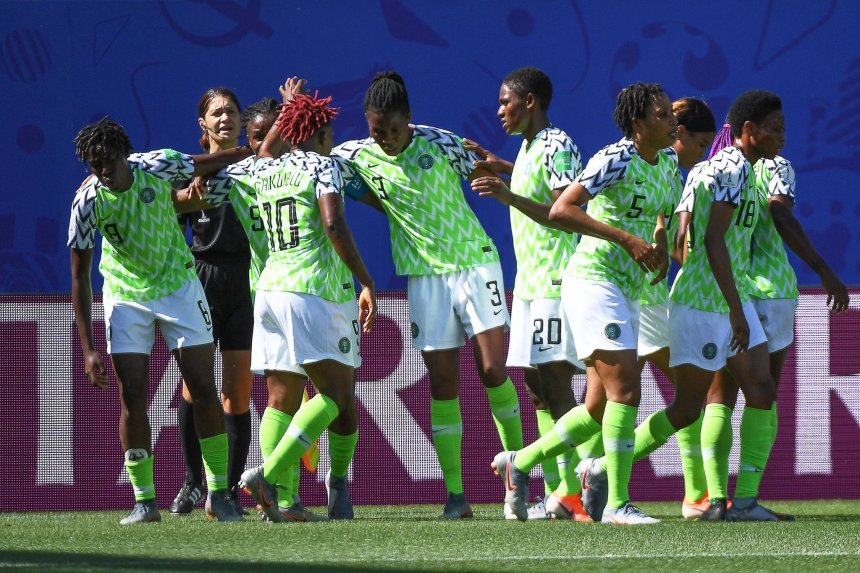 Super Falcons celebrating during a game.