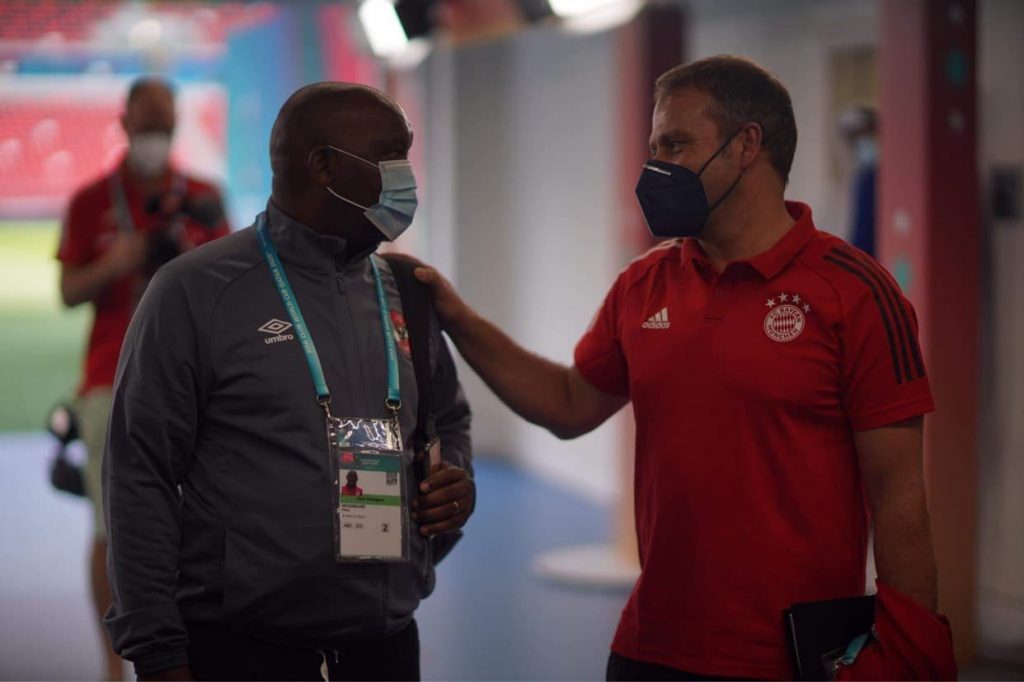 Pitso Mosimane (L) with Bayern Munich coach Hans Flick (R).