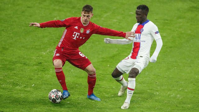 Joshua Kimmich in action against PSG's Idrissa Gueye.