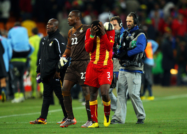 Asamoah Gyan being consoled by Kingson after missing on vital penalty.