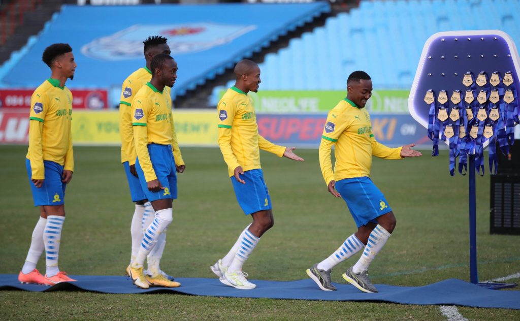 Mamelodi Sundowns players dancing before receiving their medals.