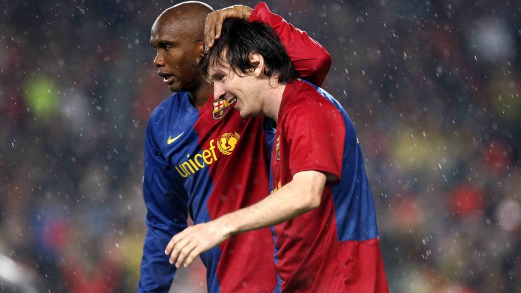 Samuel Eto'o celebrating with Messi.