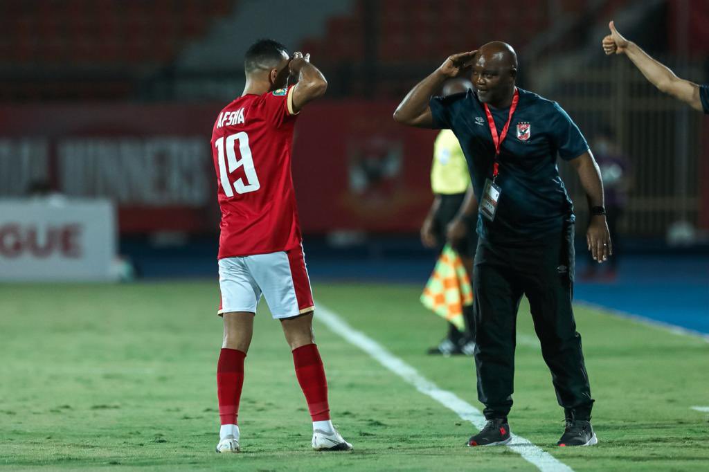 Pitso Mosimane celebrating with Mohamed Magdy Afsha. ©Al Ahly