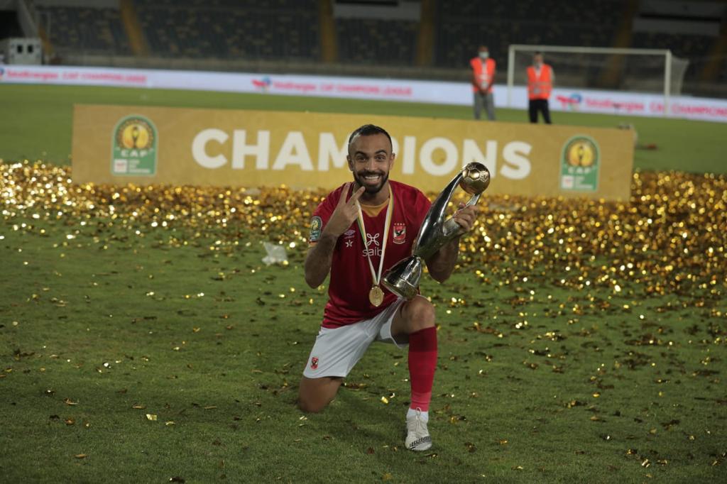 Mohamed Magdy Afsha celebrating with his 2nd CAF CL trophy.