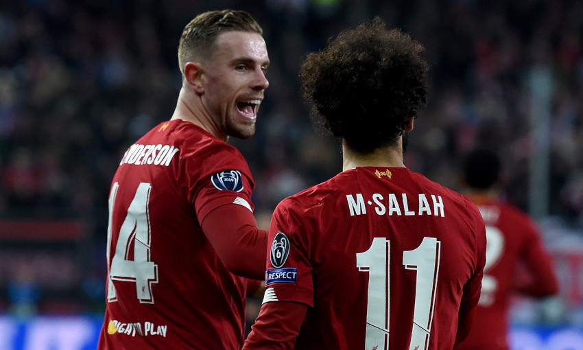 Jordan Henderson celebrating a goal with Mohamed Salah.