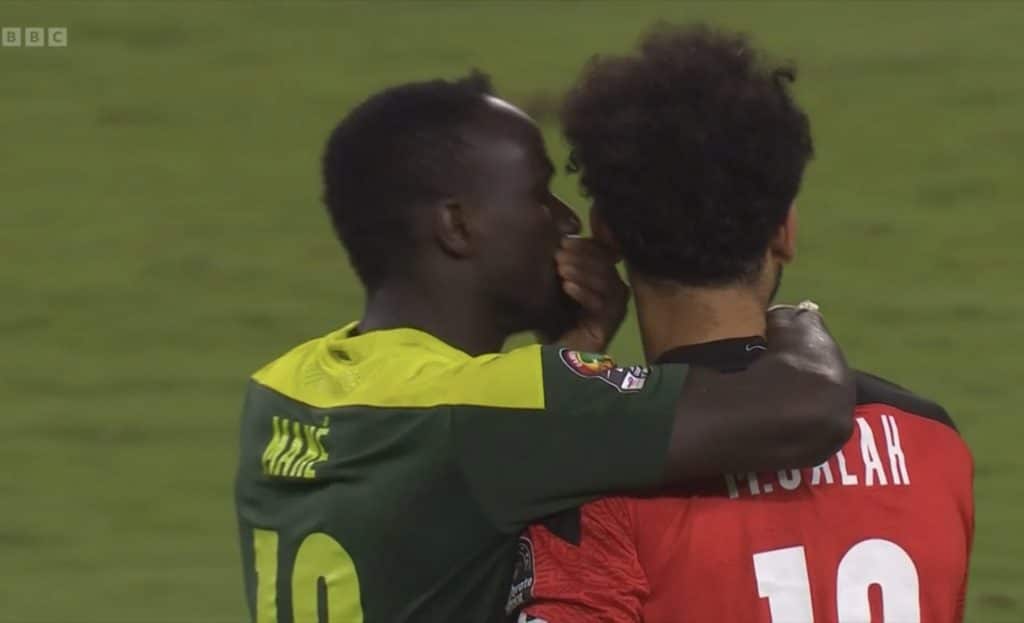 Sadio Mane consoling Liverpool teammate Mohamed Salah after the game. ©BBC