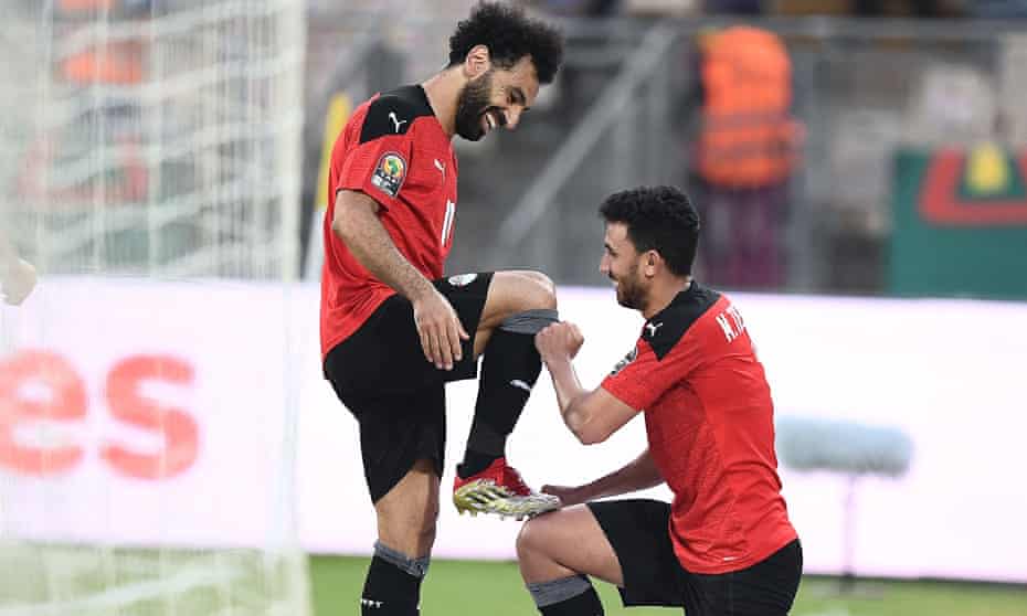 Mohamed Salah celebrating with Mahmoud Trezeguet against Morocco.