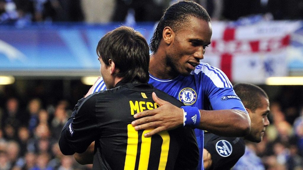 Didier Drogba and Lionel Messi hugging each other during an UCL game.