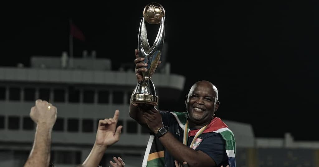 Pitso Mosimane with the CAF Champions league trophy.