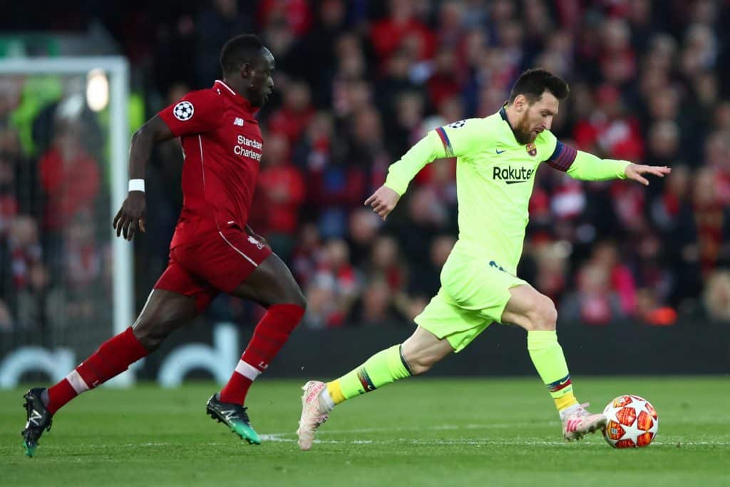 Lionel Messi in action against Sadio Mane as Liverpool humiliated Barcelona in 2019.