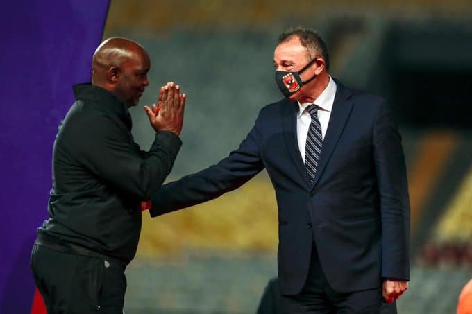 Pitso Mosimane greeting Al Ahly president Mahmoud El-Khatib.