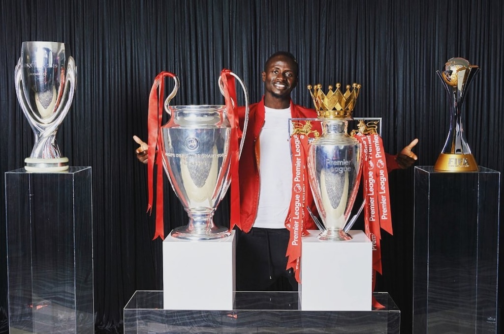 Sadio mane with some of his trophies at Liverpool.