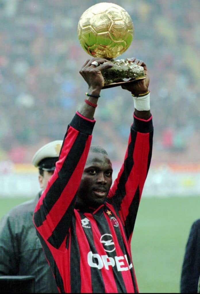 George Weah lifting his Ballon d'or in 1995 in front of AC Milan fans.