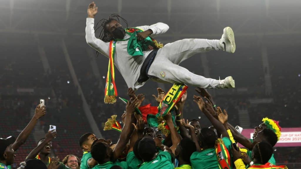 Aliou Cisse being lifted by his players after AFCON 2021 triumph in Cameroon.