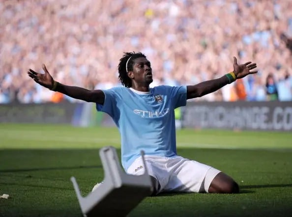 Emmanuel Adebayor celebrating in front of Arsenal fans in his debut season with Manchester City.