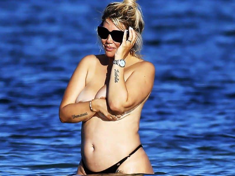 Wanda Nara goes topless at beach.