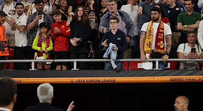 Mourinho threw his medal to a young fan in the crowd.